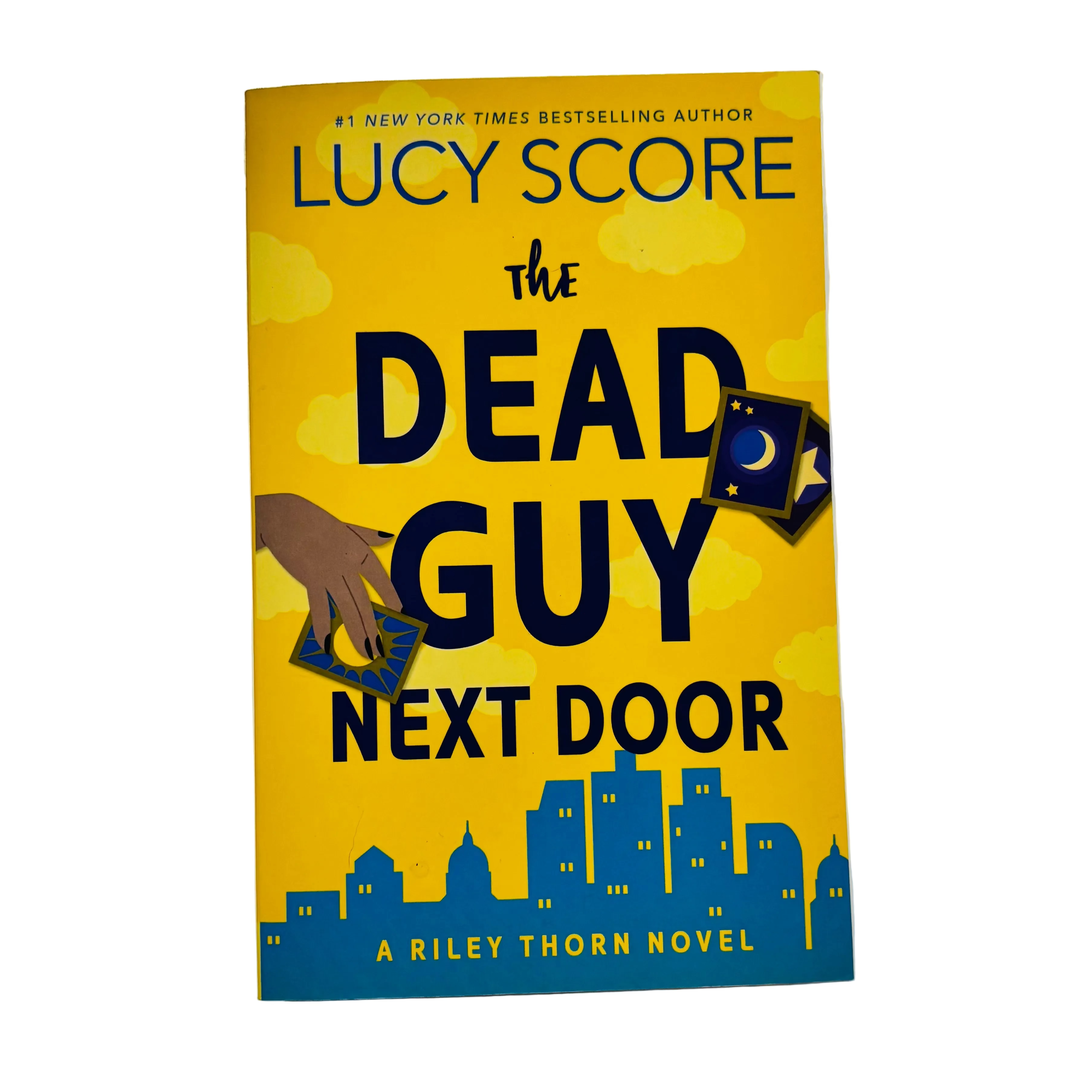 The Dead Guy Next Door by Lucy Score